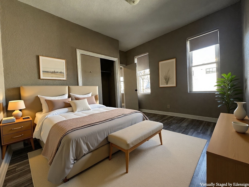 1870 Beacon Street, Unit 310 Brookline, MA 02445 - Photo 3 of 10 a spacious bedroom with a bed and window