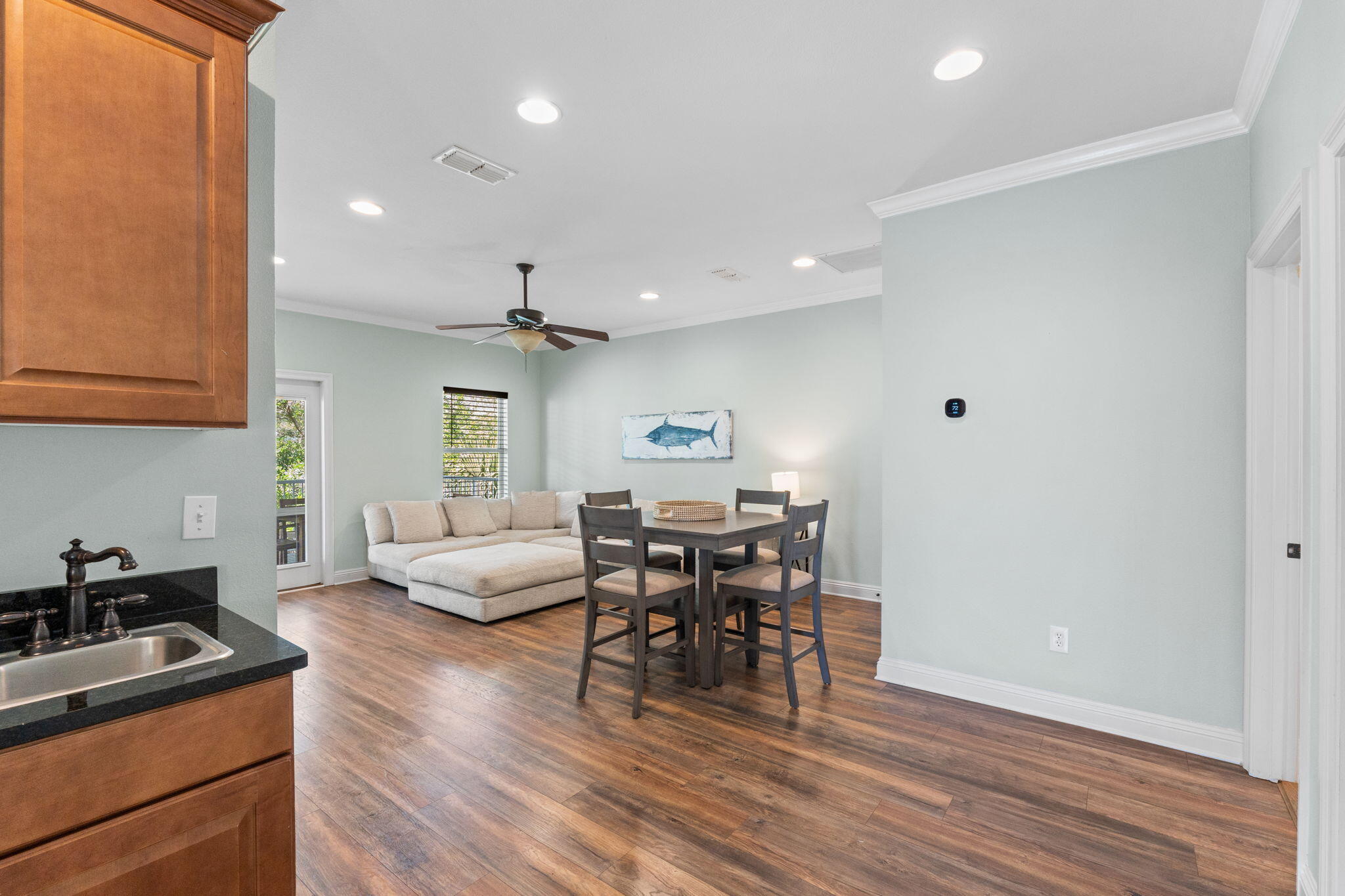 209 Grand Key Loop East Destin, FL 32541 - Photo 33 of 59 a view of a dining room with furniture and wooden floor