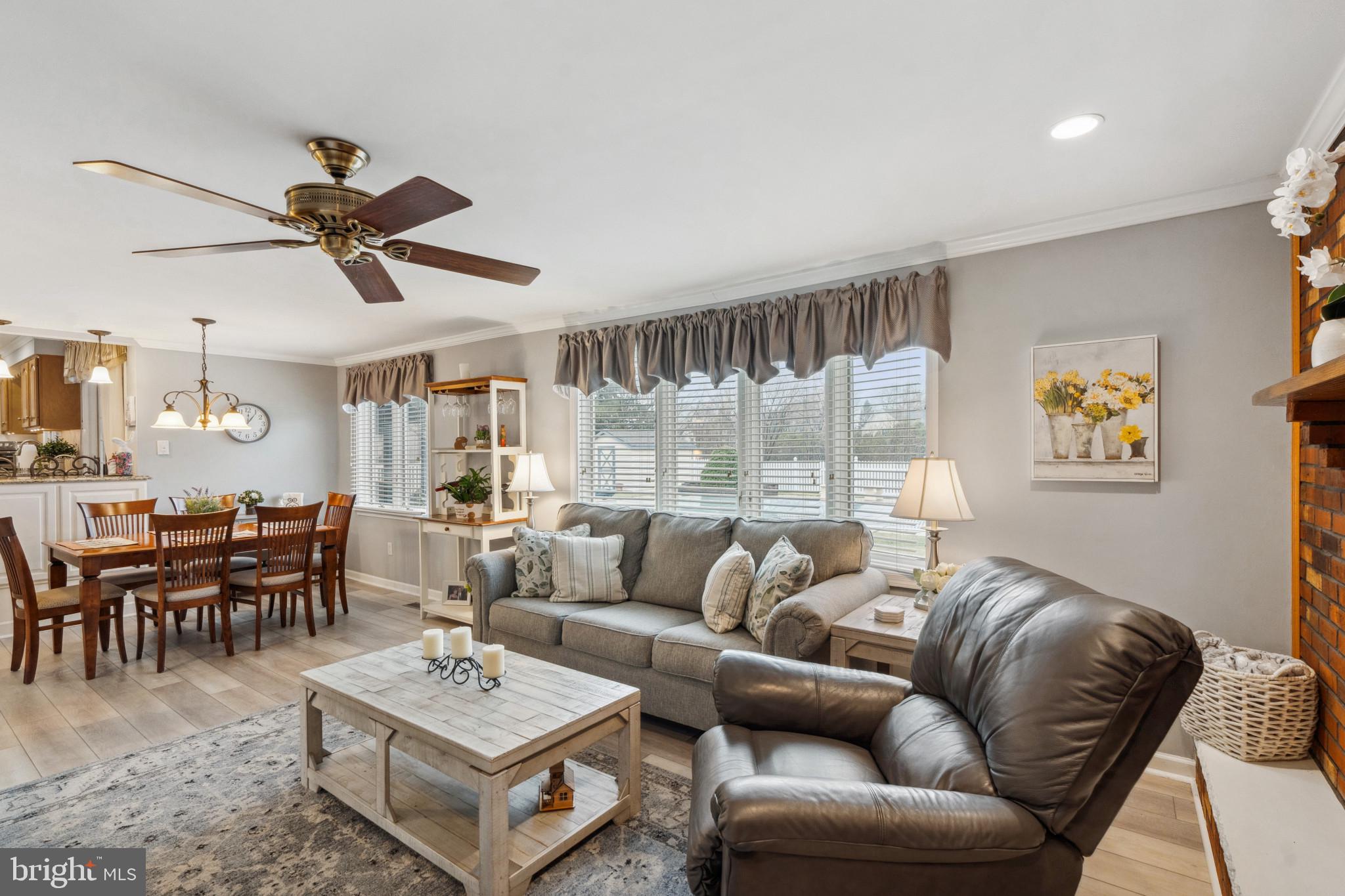 237 Aqua Lane Delran, NJ 08075 - Photo 11 of 35 a living room with furniture a table and a large window