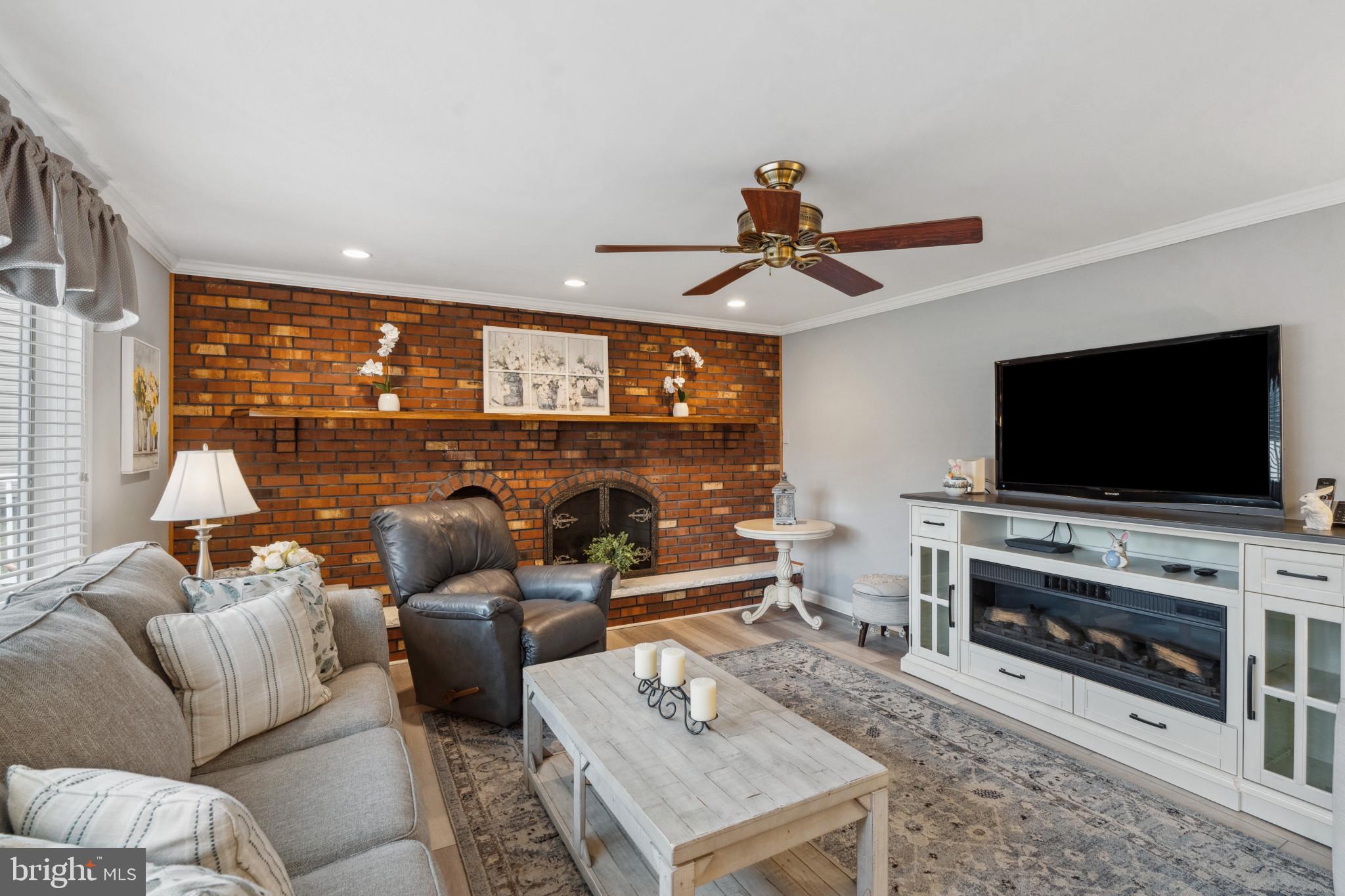 237 Aqua Lane Delran, NJ 08075 - Photo 14 of 35 a living room with furniture and a flat screen tv