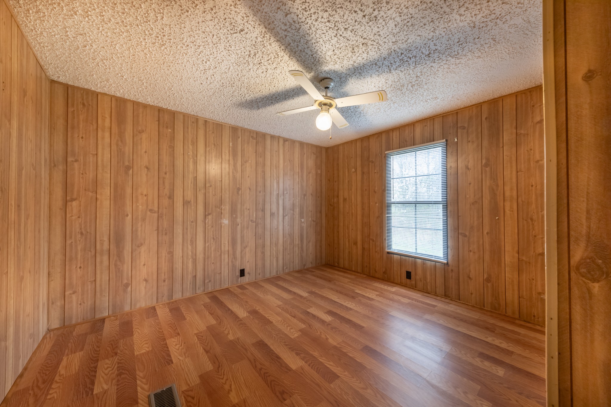 234 Dunn Fall River Road Lawrenceburg, TN 38464 - Photo 10 of 12 wooden floor in an empty room with a window