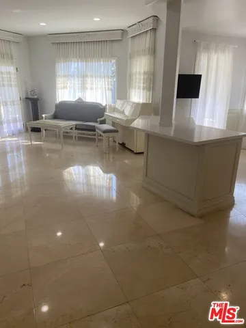 a living room with couches and a coffee table