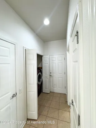 a bathroom with a shower and a glass door
