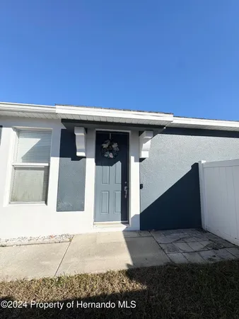 a front view of a house with a garage