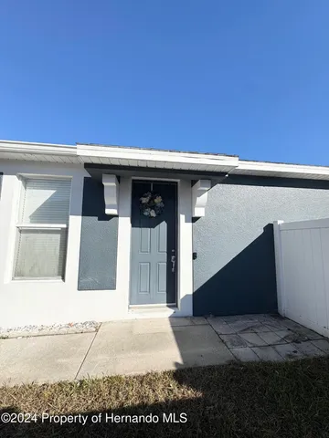 a front view of a house with a garage