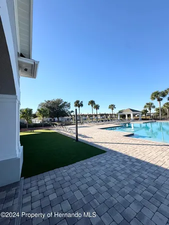 a view of swimming pool with a yard