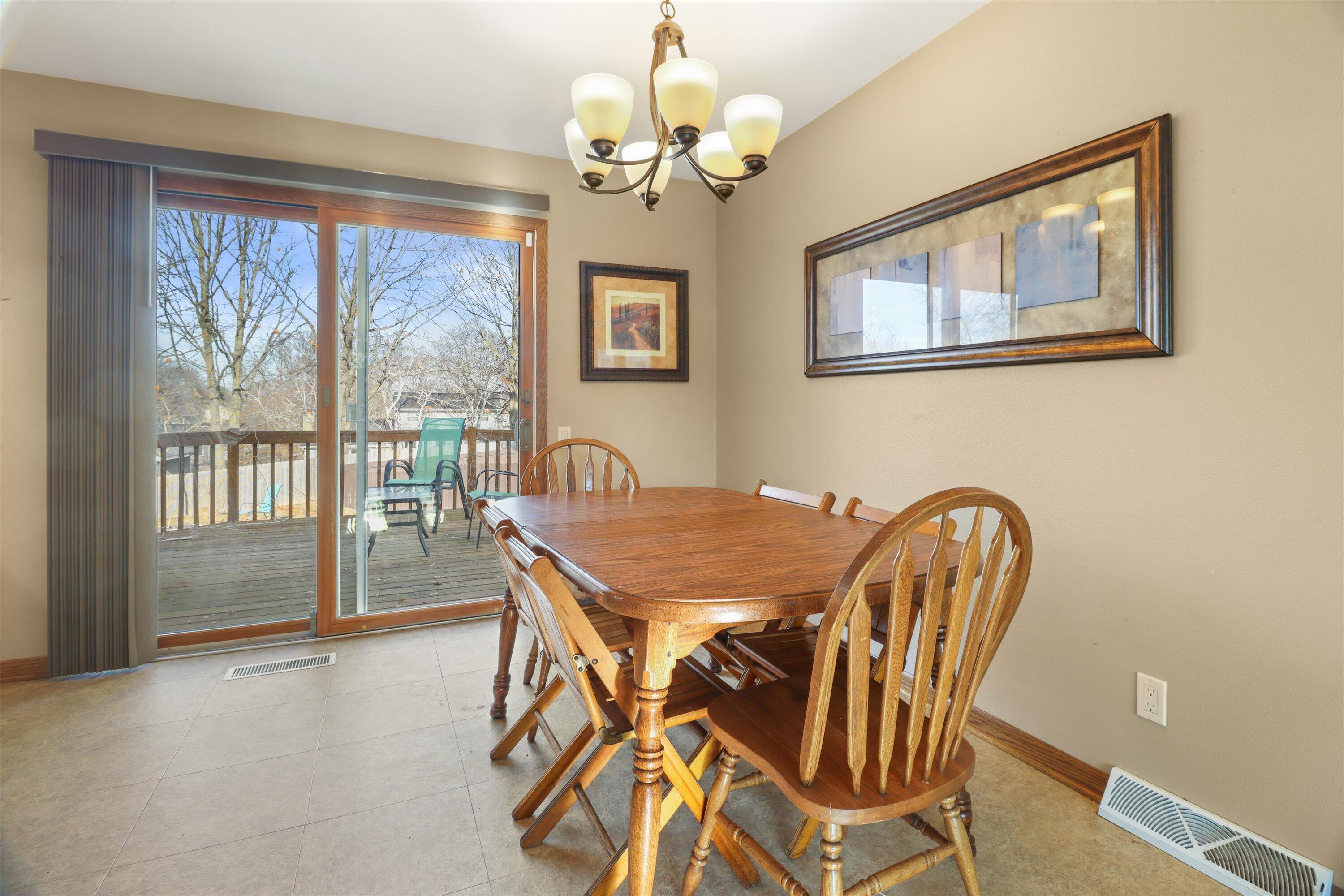 105 Winston Way Waunakee, WI 53597 - Photo 16 of 35 Dining Area with Patio Door