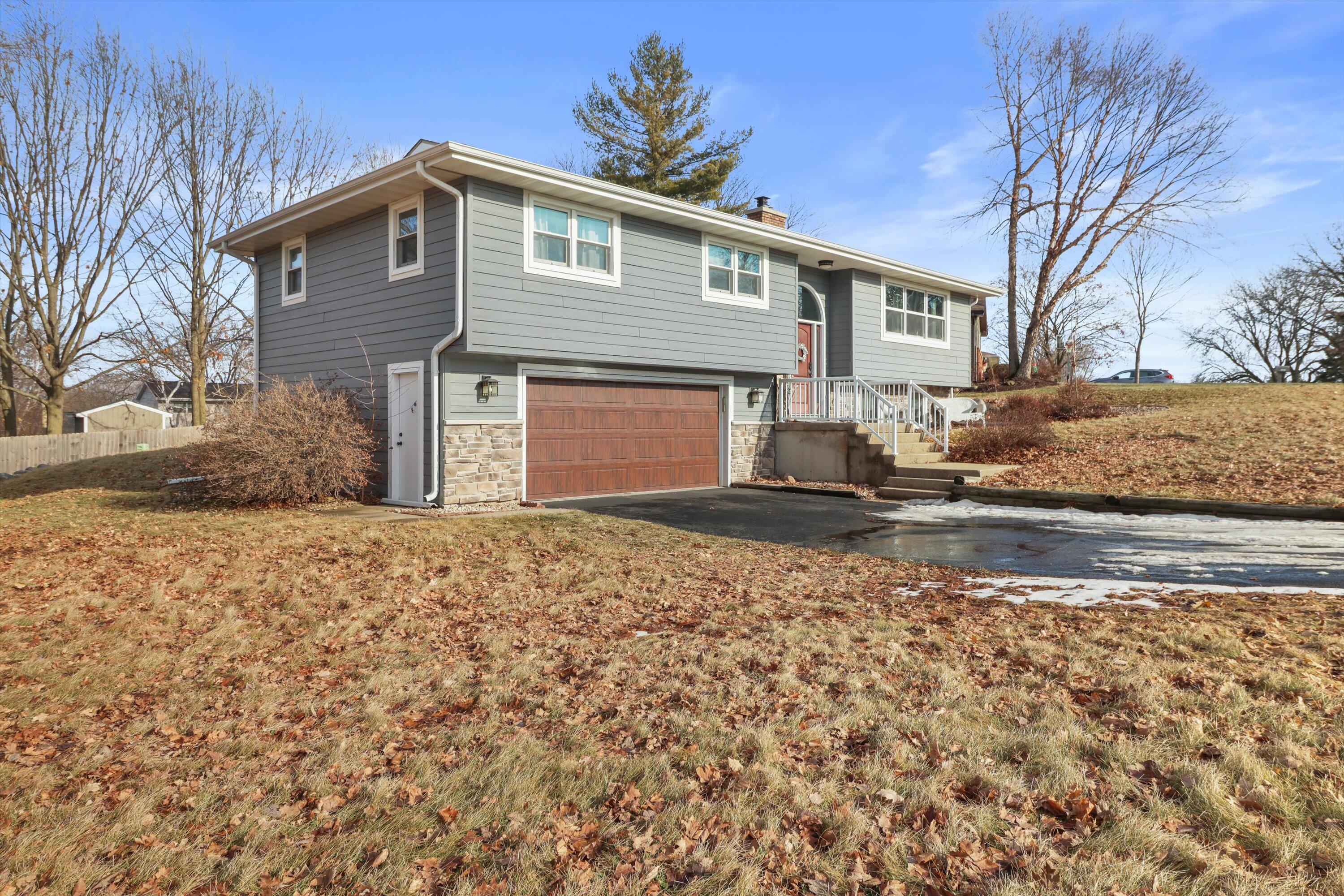 105 Winston Way Waunakee, WI 53597 - Photo 35 of 35 Front of Home and Garage