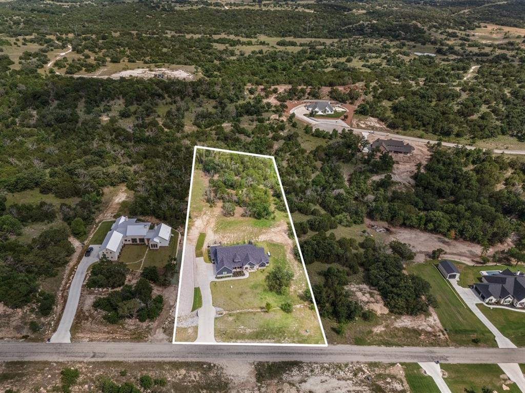 1059 Sweeney Way Weatherford, TX 76087 - Photo 33 of 37 Aerial view of the 2 acres outlined featuring a green belt at back of property
