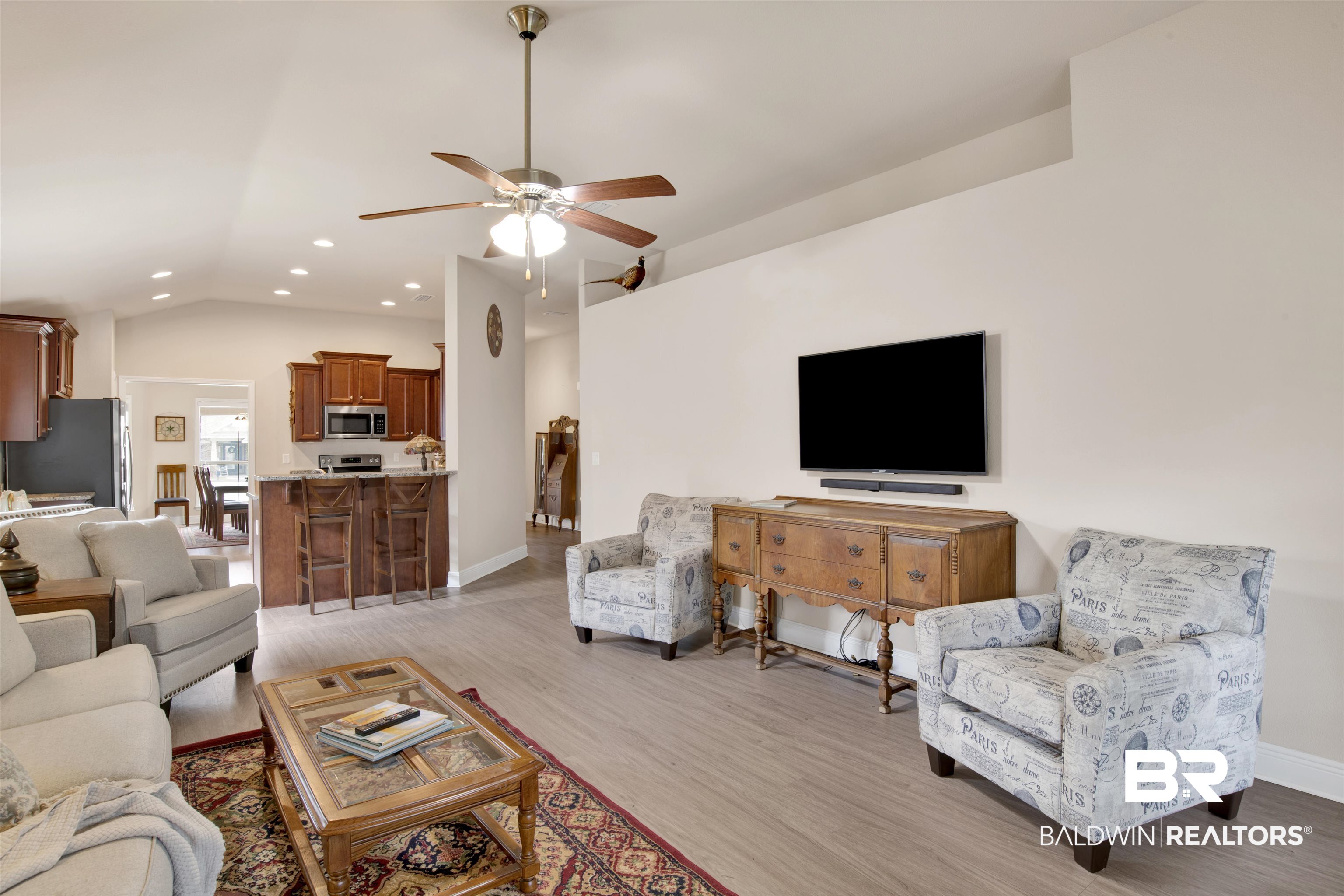 22056 Garland Loop Silverhill, AL 36576 - Photo 11 of 28 Living area with vaulted ceiling, baseboards, light wood-style floors, ceiling fan, and recessed lighting