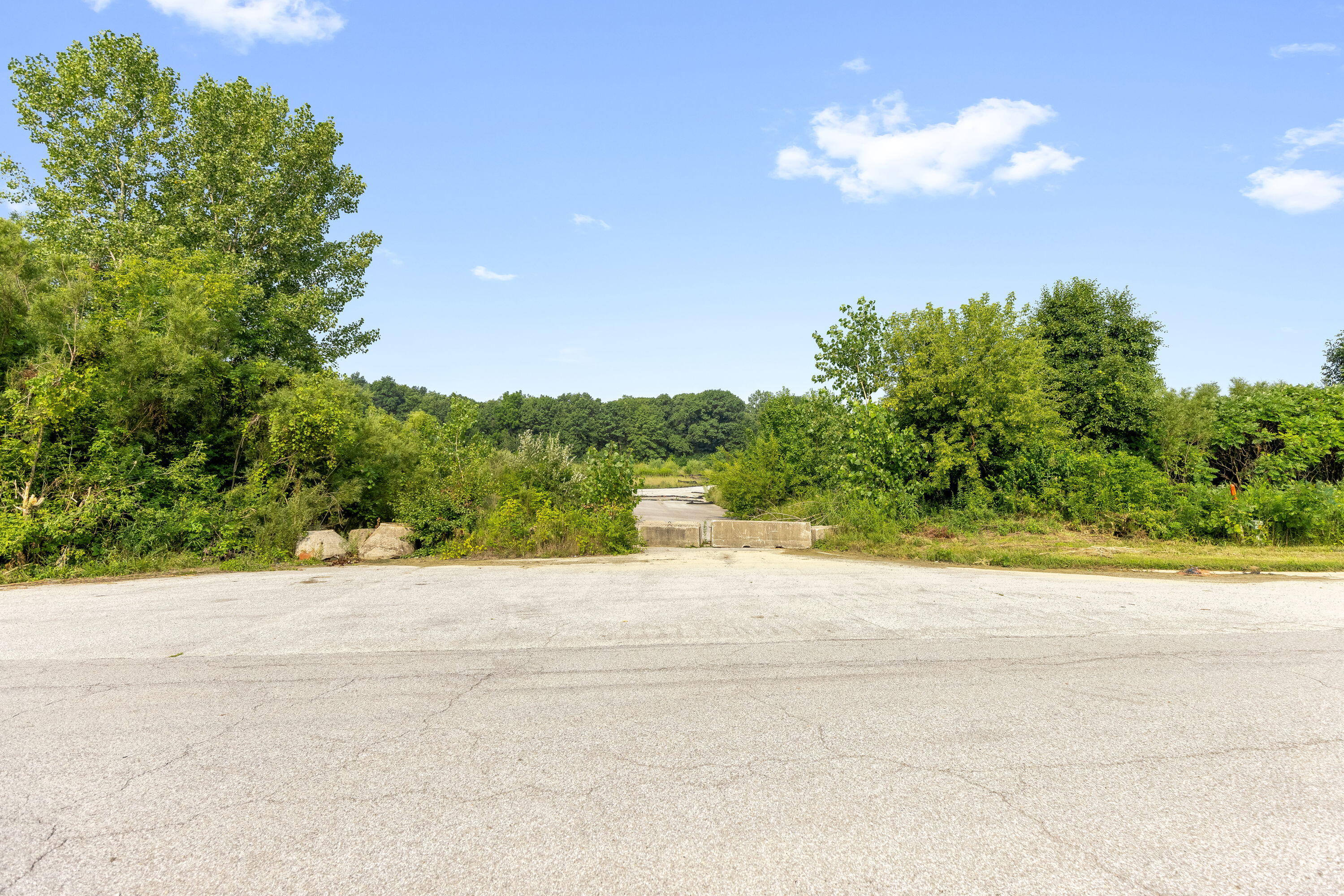 8160 Lakeview Court Winfield, IN 46307 - Photo 23 of 27 a wooden bench with trees in the background