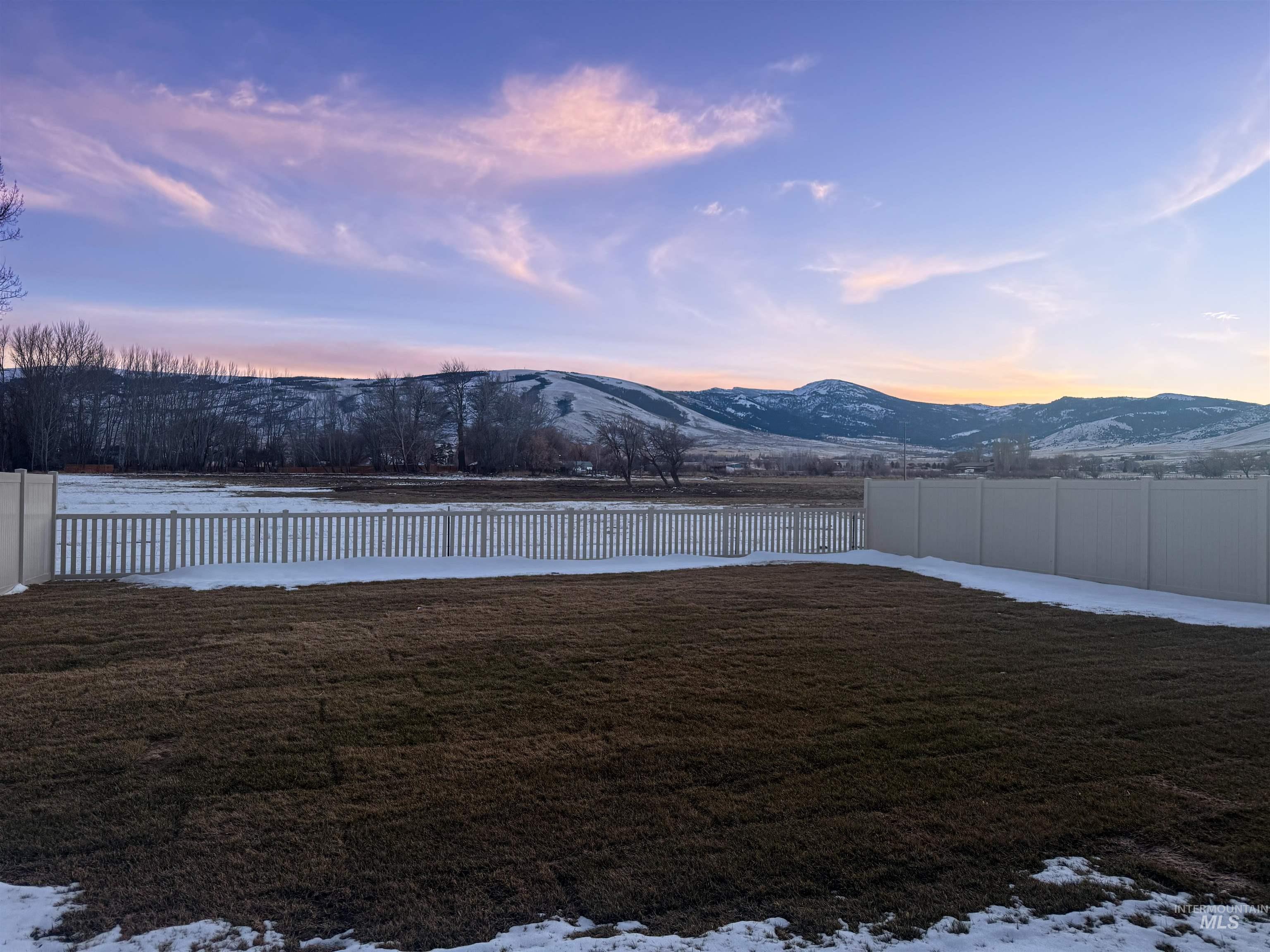 245 Whitman Street Albion, ID 83311 - Photo 14 of 15 Snowy yard featuring a fenced backyard