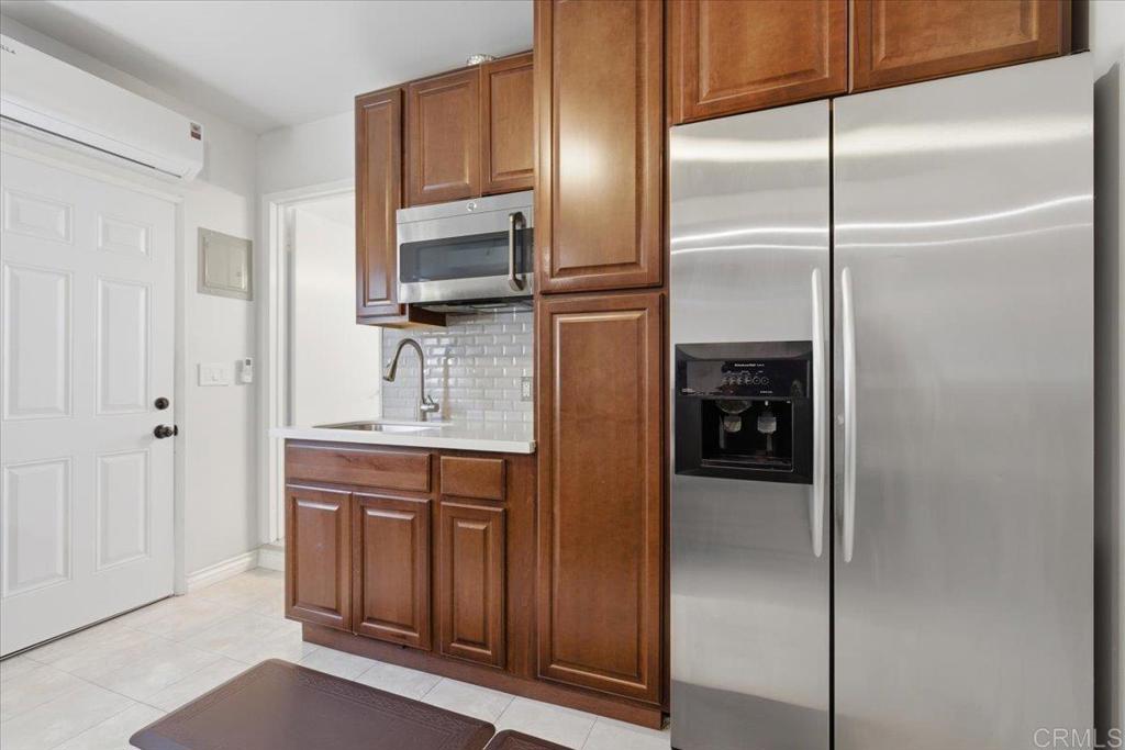 1915 Edith Drive Escondido, CA 92026 - Photo 16 of 41 a kitchen with a refrigerator and a sink