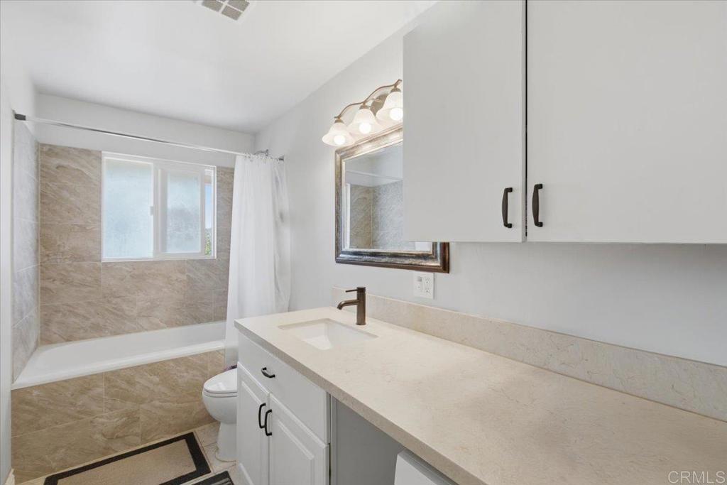 1915 Edith Drive Escondido, CA 92026 - Photo 18 of 41 a bathroom with a sink a toilet and shower