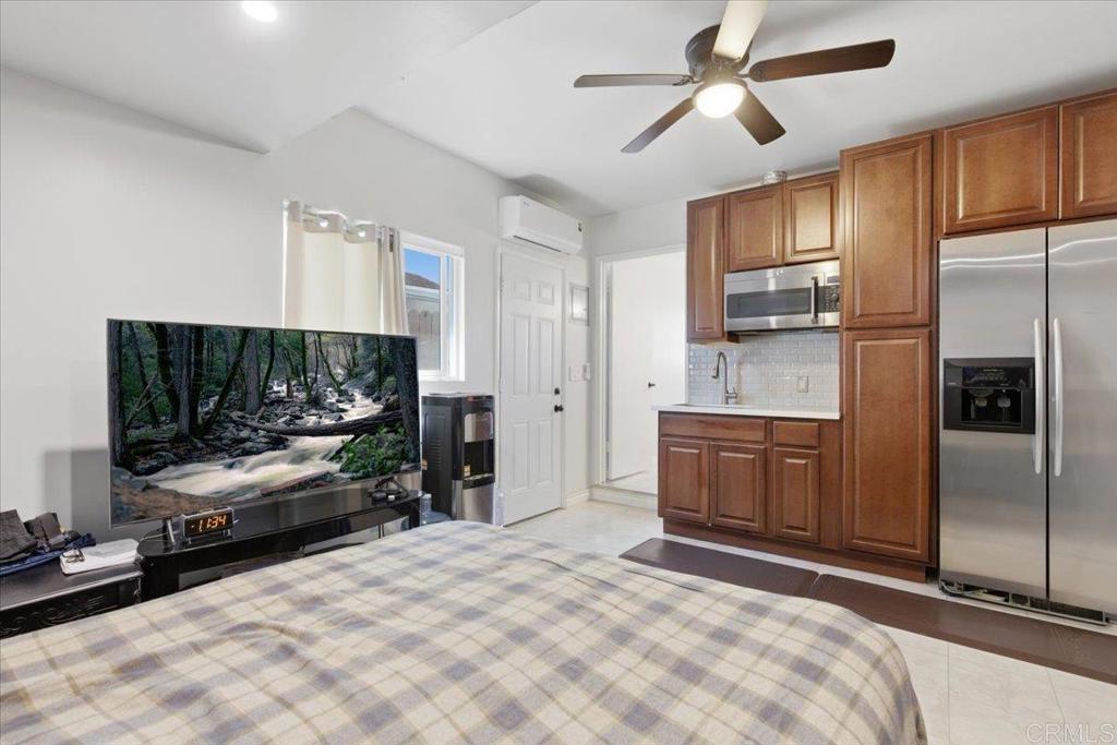 1915 Edith Drive Escondido, CA 92026 - Photo 19 of 41 a bedroom with a bed and a flat screen tv