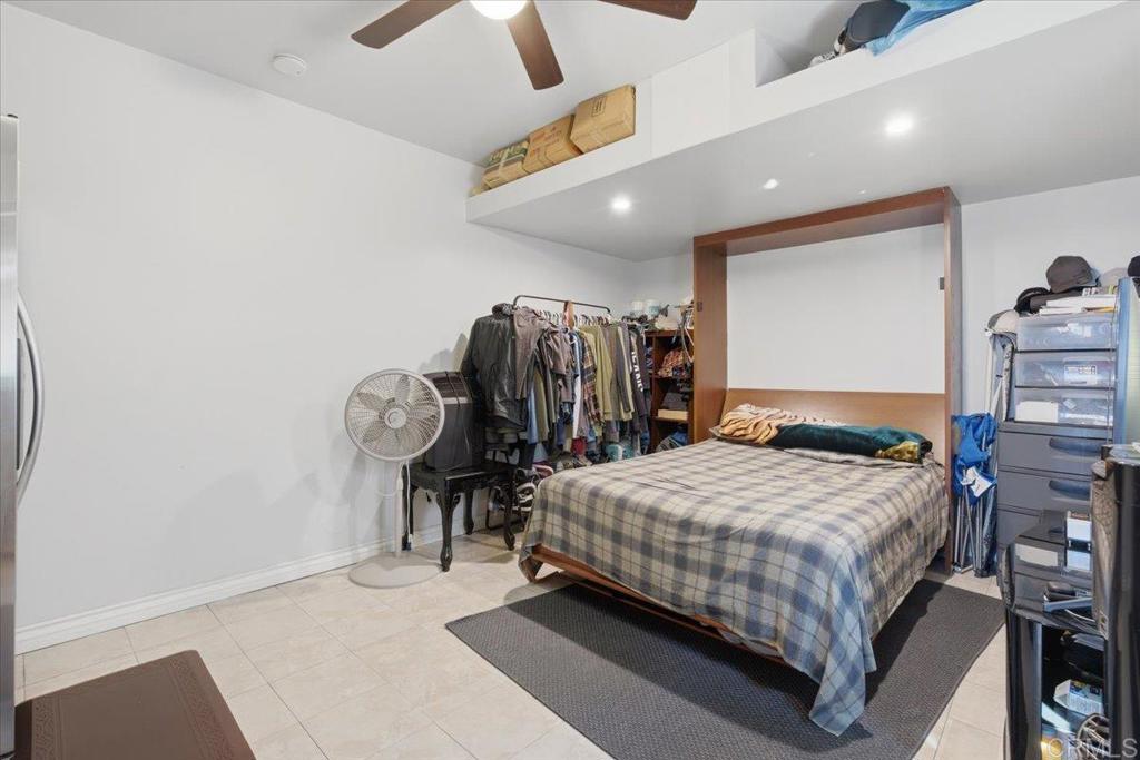 1915 Edith Drive Escondido, CA 92026 - Photo 20 of 41 a bedroom with a bed and large mirror