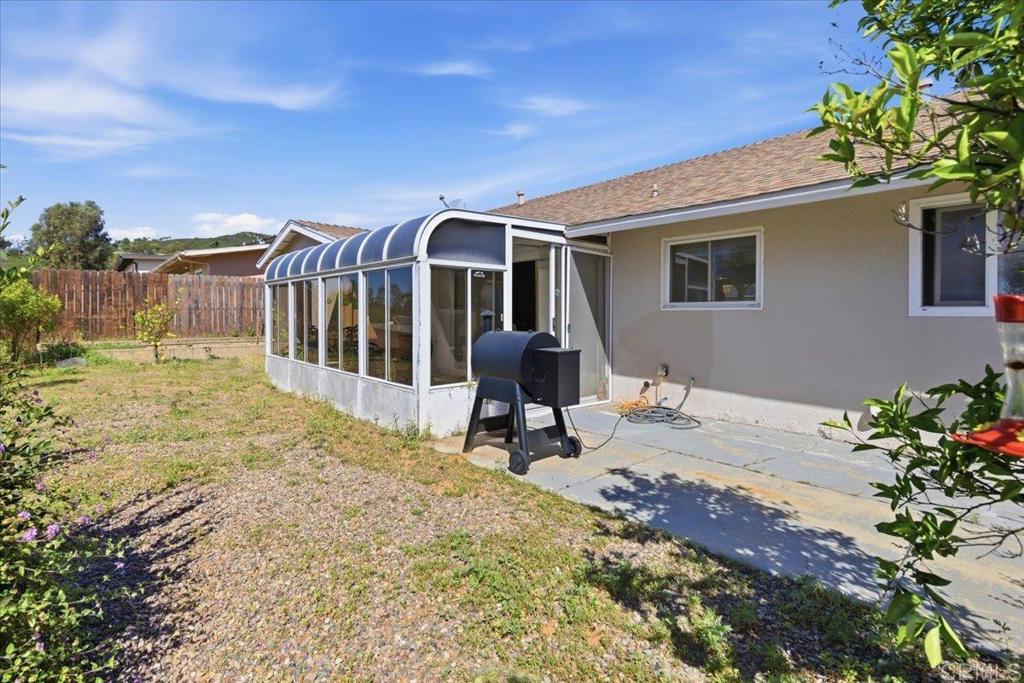 1915 Edith Drive Escondido, CA 92026 - Photo 27 of 41 a view of a house with backyard and sitting area