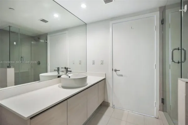 a bathroom with a sink and mirror