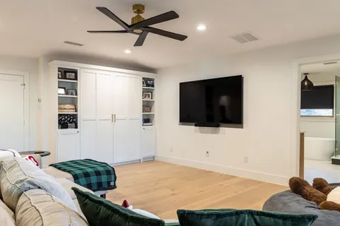 a room with gym equipment and a large window