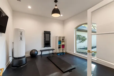 a bedroom with furniture and a chandelier