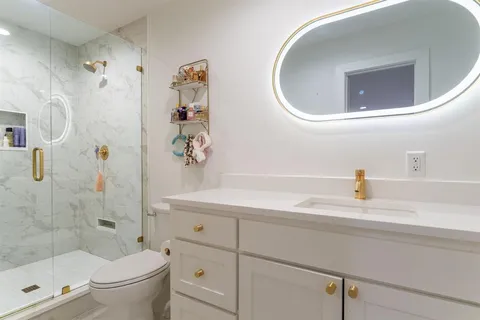 a bathroom with a shower and a sink