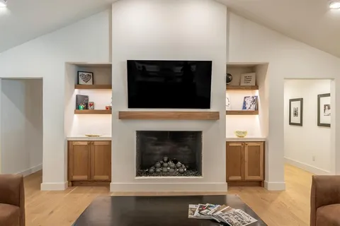 a kitchen with stainless steel appliances granite countertop a stove and a refrigerator