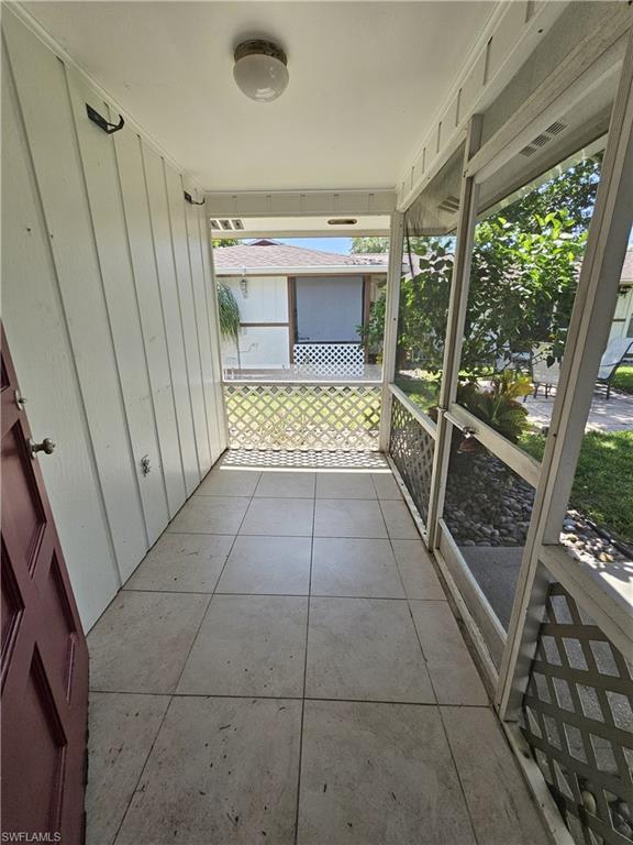 828 96th Avenue North, Unit B Naples, FL 34108 - Photo 12 of 13 View of unfurnished sunroom