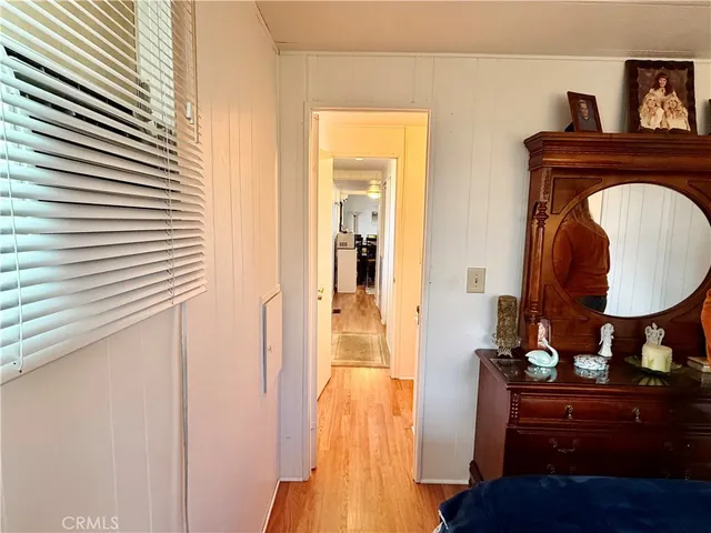 a living room with furniture and a mirror