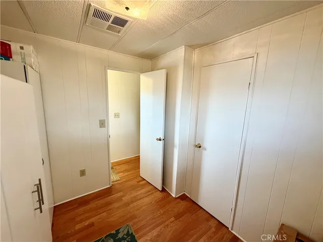 a bedroom with a bed and a shower