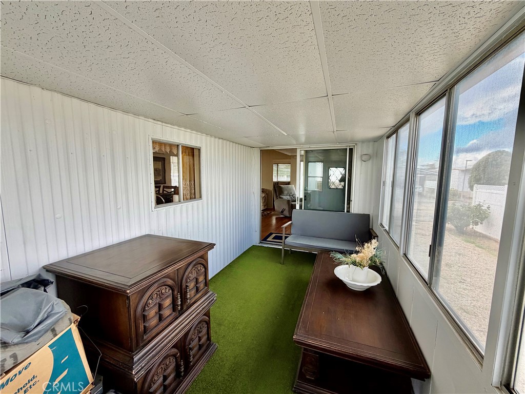 12582 2nd Street, Unit 65 Yucaipa, CA 92399 - Photo 7 of 21 a living room with furniture and a table