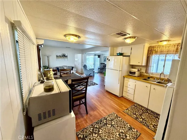 a room with furniture a flat screen tv and a table