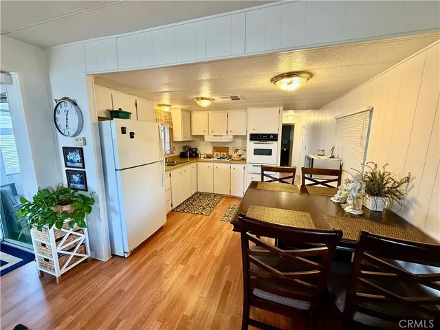 a kitchen with sink refrigerator and stove