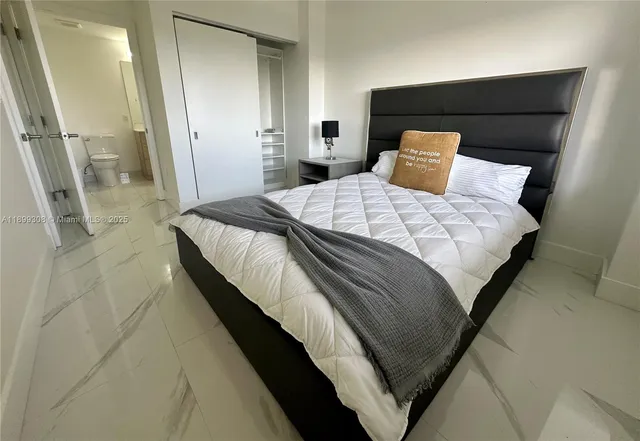 a view of a building with sitting area and garden