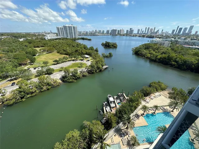 an aerial view of a house with a lake view