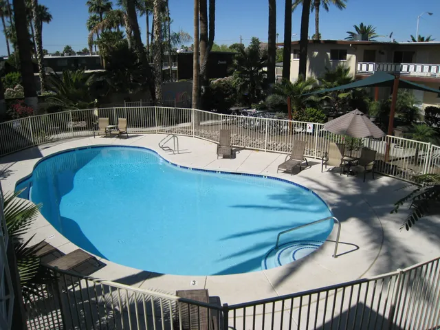 a view of a swimming pool with a patio