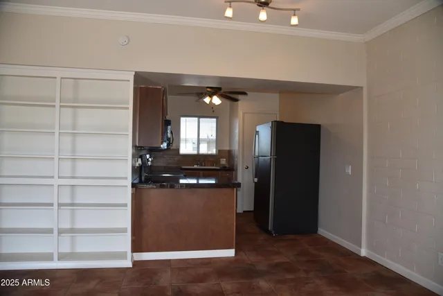 a view of a living room with wooden floor