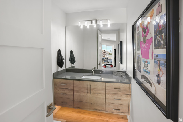 1354 South 800 East Mapleton, UT 84664 - Photo 83 of 129 Half bath with vanity and light wood-type flooring attached to gym