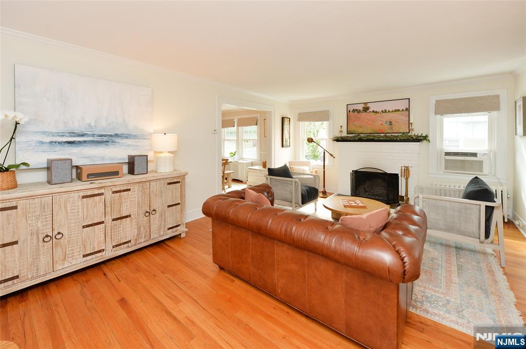 570 Shelton Road Ridgewood, NJ 07450 - Photo 3 of 26 a living room with furniture and a fireplace