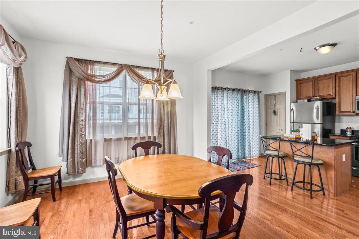 14 Indiana Circle Lemoyne, PA 17043 - Photo 11 of 30 a view of a dining room with furniture window and wooden floor