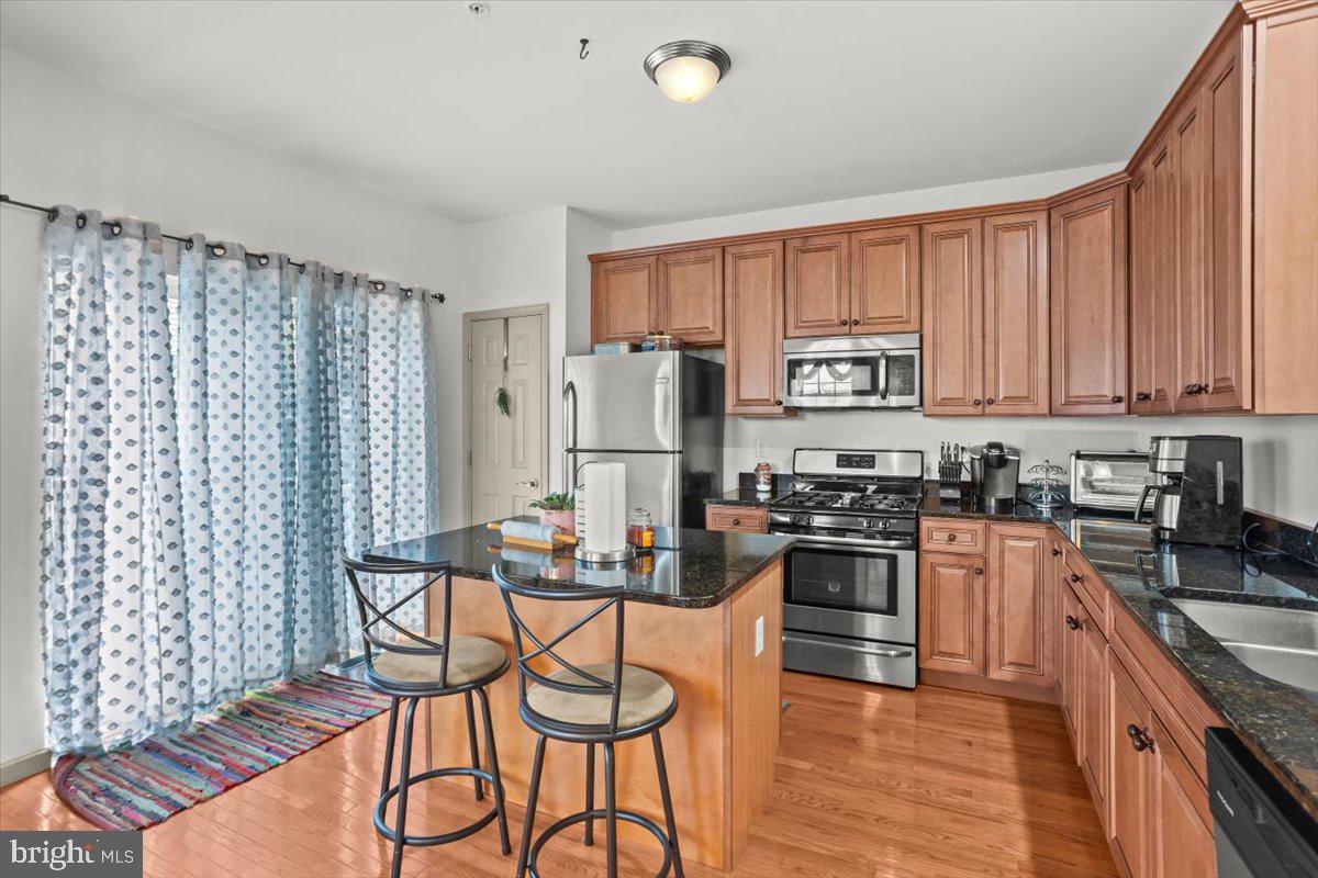 14 Indiana Circle Lemoyne, PA 17043 - Photo 13 of 30 a kitchen with granite countertop stainless steel appliances a refrigerator stove top oven and sink