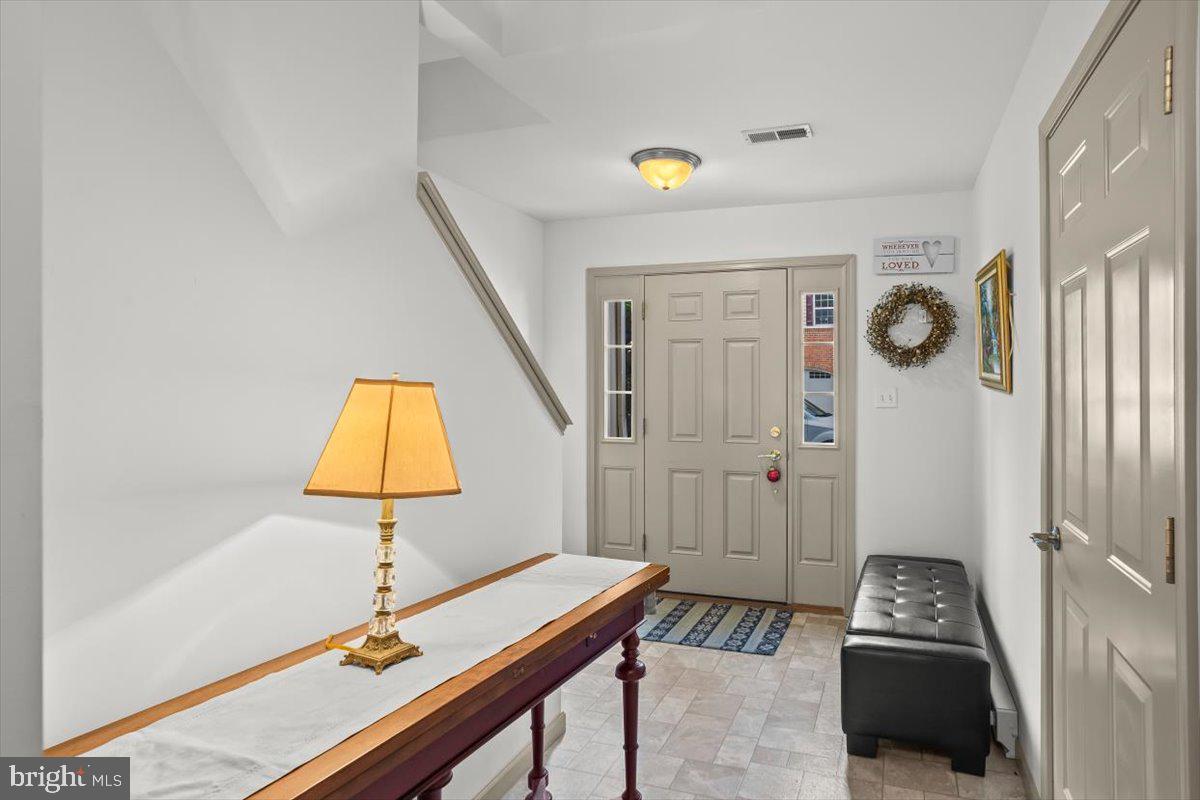 14 Indiana Circle Lemoyne, PA 17043 - Photo 3 of 30 a bedroom with a bed and a lamp