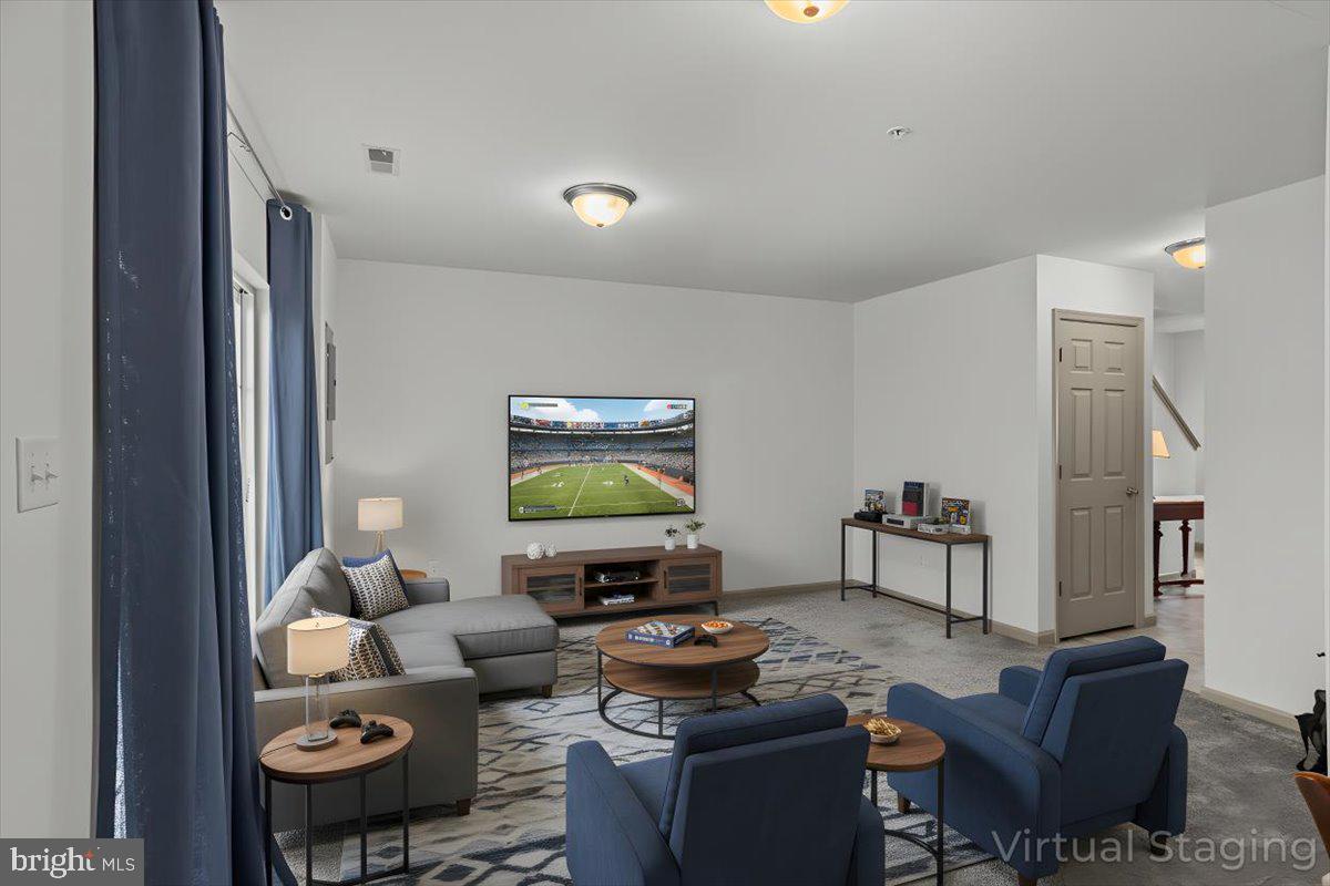 14 Indiana Circle Lemoyne, PA 17043 - Photo 6 of 30 a living room with furniture and a flat screen tv