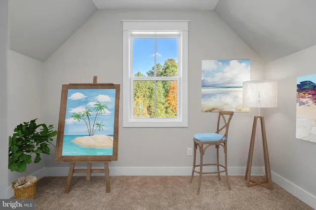 a living room with a window and a table