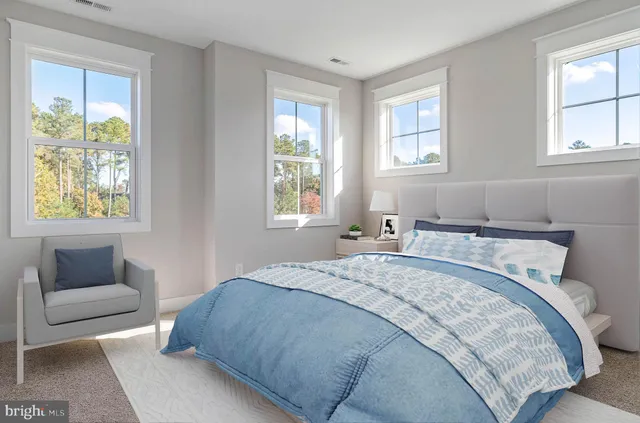 a bedroom with a bed and a couch