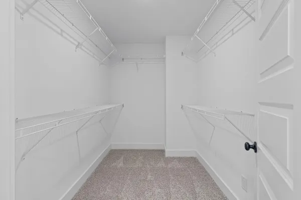 a view of an empty walk in closet