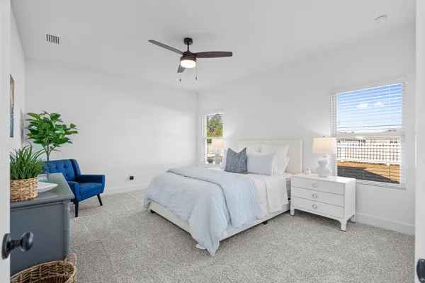 a bedroom with a bed furniture and a window