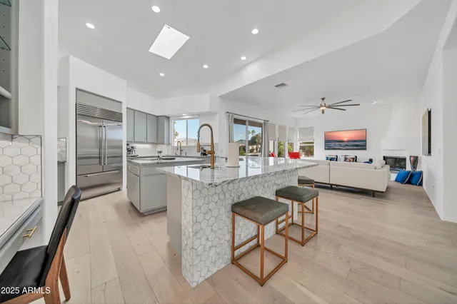 a kitchen with sink refrigerator and stove