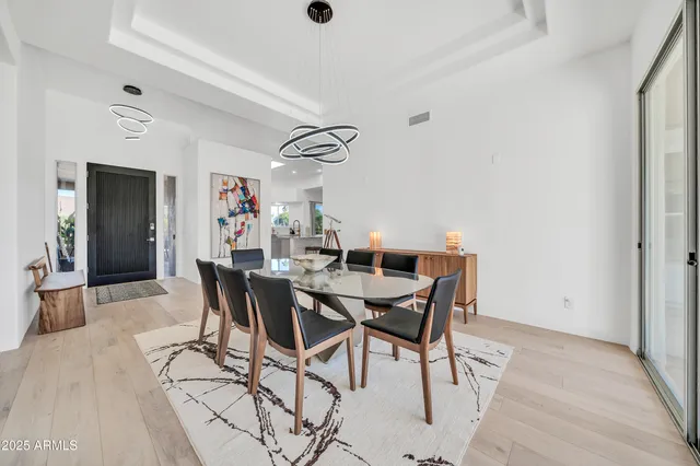 a view of kitchen with refrigerator and microwave