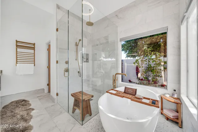 a spacious bedroom with a bed and window