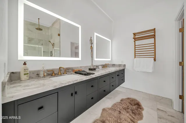 a spacious bathroom with a tub and a sink